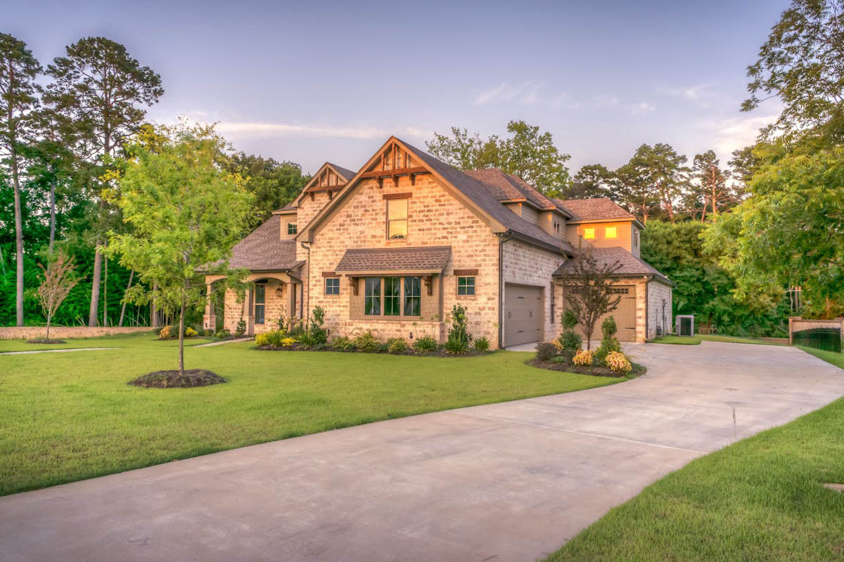 Modern stone home with glass and stone facade