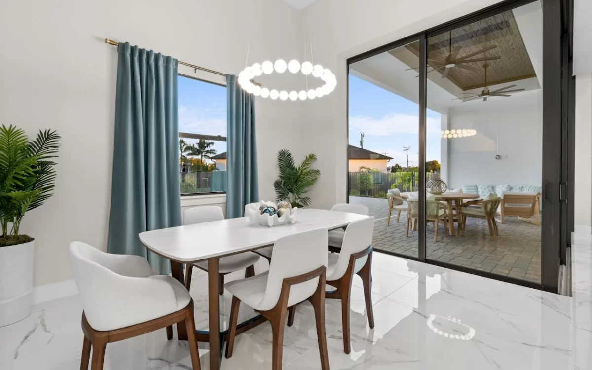 Elegant marble dining table with a polished surface and modern design, set in a contemporary dining room